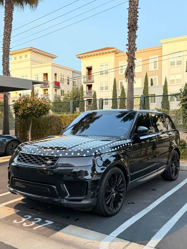 Black Range Rover Sport with a freshly polished gloss finish after a full detail